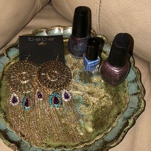 Bebe earnings & three nail polishes, sinful, sally